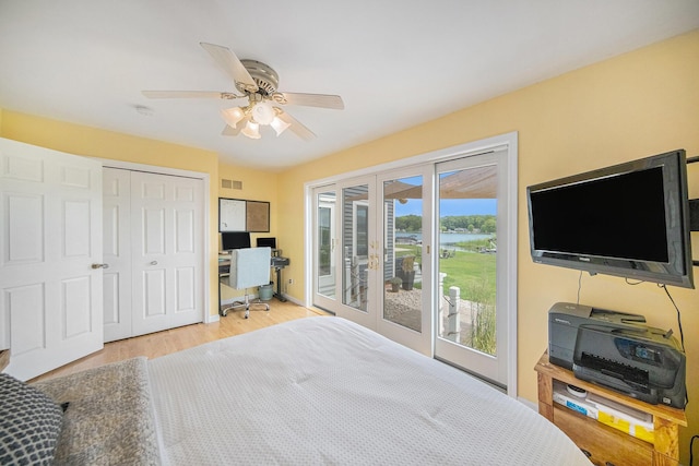 828 Russmiller Loop, Brooklyn, MI 49230 - bedroom with access to exterior, a desk, wood finished floors, a closet, and ceiling fan