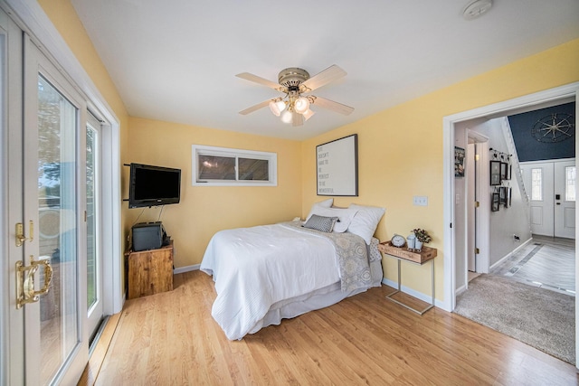 828 Russmiller Loop, Brooklyn, MI 49230 - bedroom featuring light wood-type flooring, access to exterior, and ceiling fan