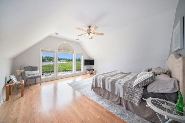 828 Russmiller Loop, Brooklyn, MI 49230 - bedroom featuring wood finished floors, vaulted ceiling, and a ceiling fan
