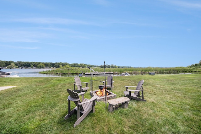 828 Russmiller Loop, Brooklyn, MI 49230 - view of green lawn featuring a fire pit and a water view