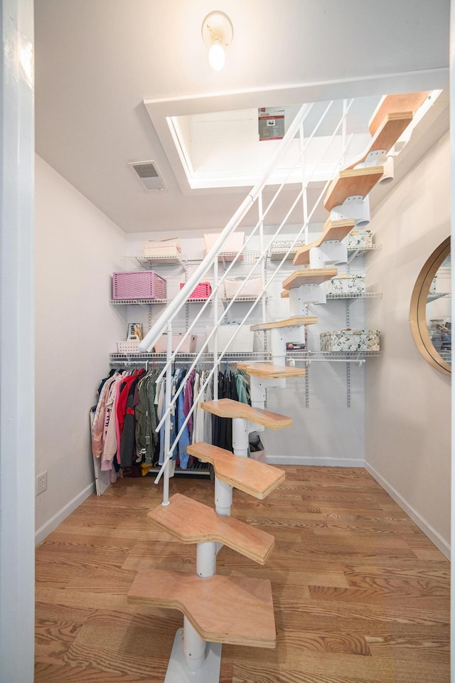 828 Russmiller Loop, Brooklyn, MI 49230 - stairway featuring baseboards and wood finished floors