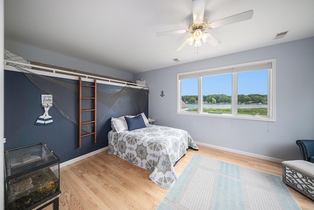 828 Russmiller Loop, Brooklyn, MI 49230 - bedroom featuring wood finished floors and ceiling fan