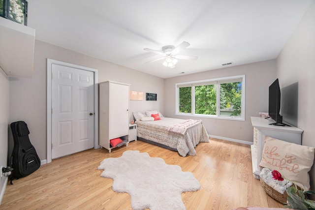 828 Russmiller Loop, Brooklyn, MI 49230 - bedroom featuring light wood-style flooring and ceiling fan