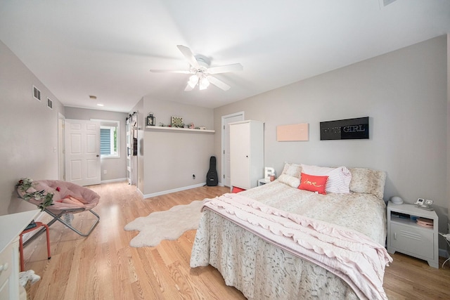 828 Russmiller Loop, Brooklyn, MI 49230 - bedroom featuring light wood finished floors and a ceiling fan