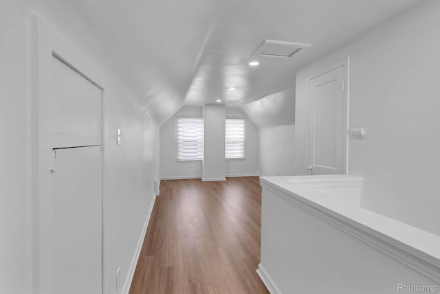 7768 Asbury Park, Dearborn, MI 48228 - corridor featuring lofted ceiling, wood finished floors, and attic access