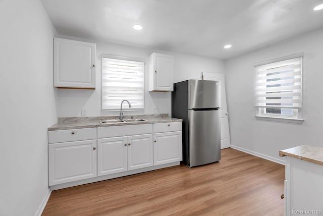 7768 Asbury Park, Dearborn, MI 48228 - kitchen featuring freestanding refrigerator, light countertops, plenty of natural light, and recessed lighting