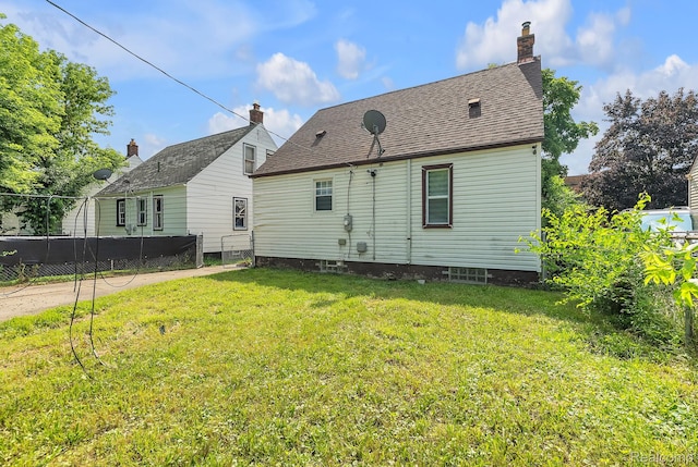 7768 Asbury Park, Dearborn, MI 48228 - rear view of property featuring a chimney
