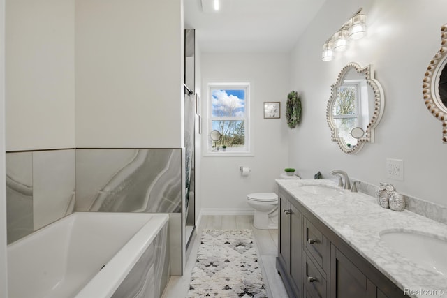 619 N Watkins, Perry, MI 48872 - bathroom featuring double vanity, a garden tub, and a shower