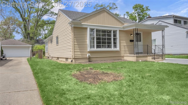 322 S Manitou Ave, Troy, MI 48017 - view of front of property featuring a detached garage, a front yard, an outdoor structure, and roof with shingles
