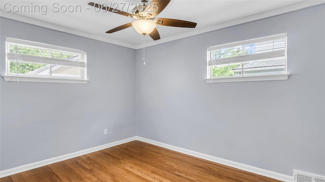 322 S Manitou Ave, Troy, MI 48017 - empty room with healthy amount of natural light, ceiling fan, and wood finished floors
