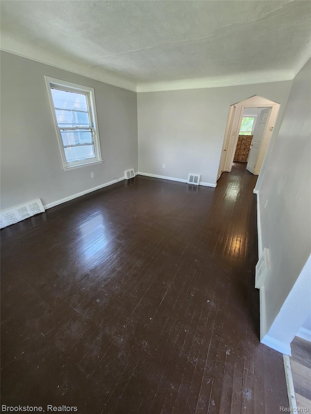 8428 Rosemont Ave, Dearborn Heights, MI 48228 - unfurnished room with dark wood-type flooring and plenty of natural light