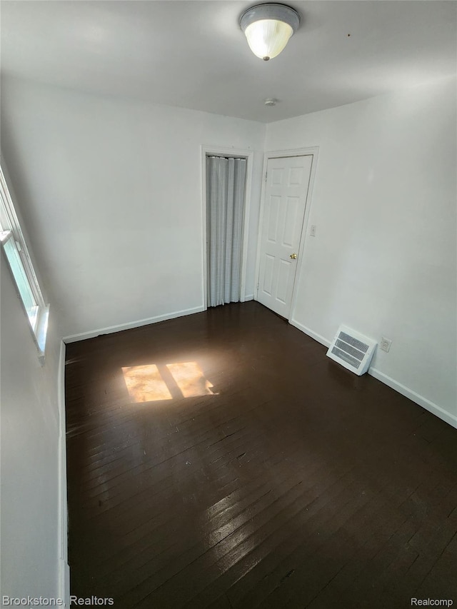 8428 Rosemont Ave, Dearborn Heights, MI 48228 - empty room featuring dark wood-style floors and a smoke detector