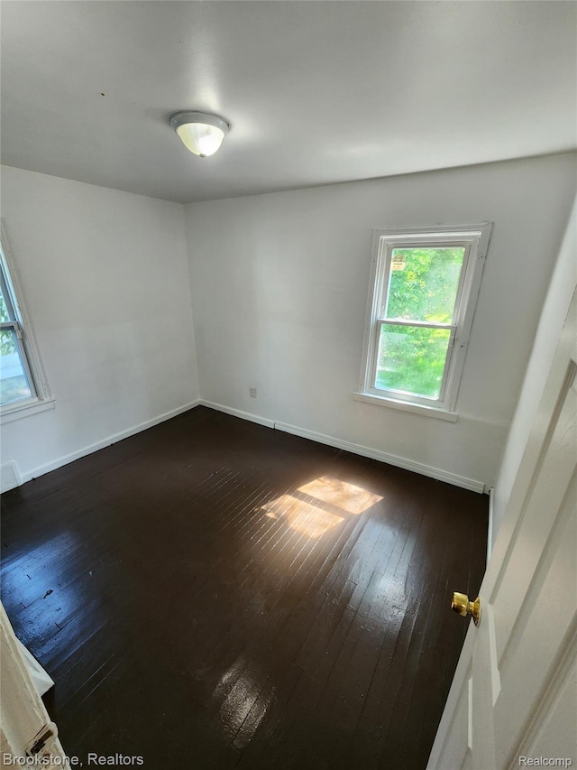 8428 Rosemont Ave, Dearborn Heights, MI 48228 - empty room with dark wood-style flooring and plenty of natural light
