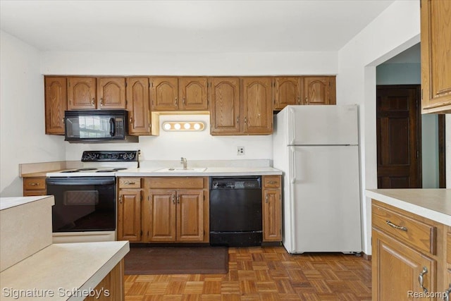 27671 W Echo Vly, Farmington Hills, MI 48334 - kitchen with black appliances, light countertops, and brown cabinets