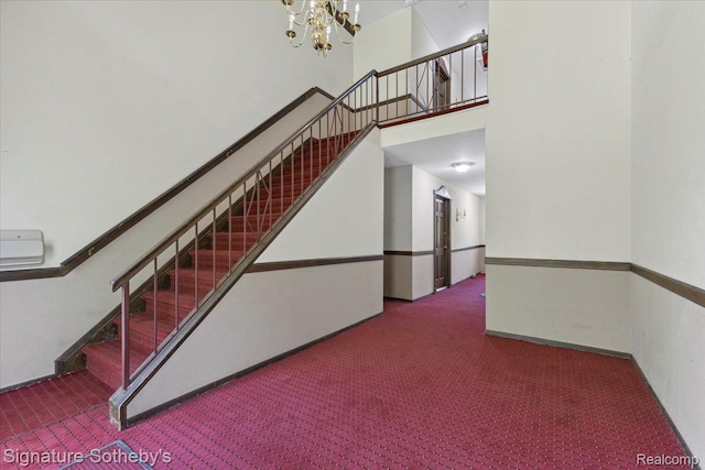 27671 W Echo Vly, Farmington Hills, MI 48334 - stairs featuring carpet, a towering ceiling, and a chandelier