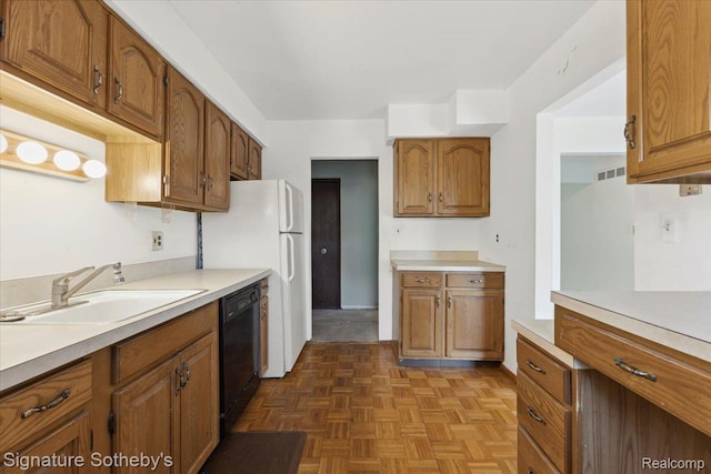 27671 W Echo Vly, Farmington Hills, MI 48334 - kitchen featuring black dishwasher, light countertops, brown cabinets, and freestanding refrigerator