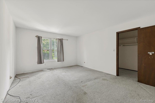 27671 W Echo Vly, Farmington Hills, MI 48334 - unfurnished bedroom with carpet, a spacious closet, and a closet