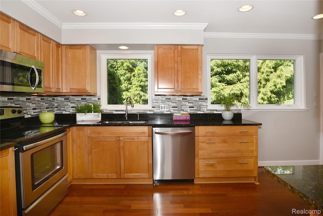 142 E Hickory Grove Rd Unit 3, Beverly Hills, MI 48304 - kitchen featuring appliances with stainless steel finishes, healthy amount of natural light, tasteful backsplash, recessed lighting, and crown molding