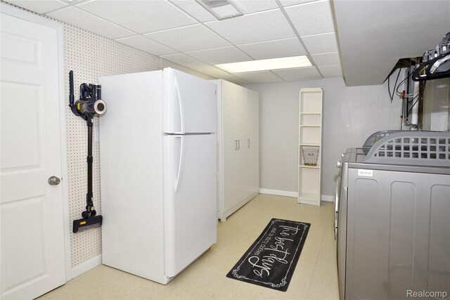 142 E Hickory Grove Rd Unit 3, Beverly Hills, MI 48304 - kitchen with freestanding refrigerator, a drop ceiling, and separate washer and dryer