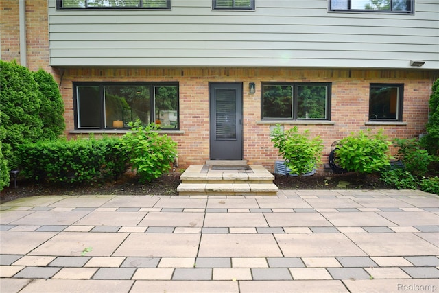 142 E Hickory Grove Rd Unit 3, Beverly Hills, MI 48304 - view of exterior entry with brick siding