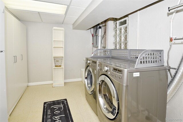 142 E Hickory Grove Rd Unit 3, Beverly Hills, MI 48304 - laundry room featuring washer and dryer and tile patterned floors
