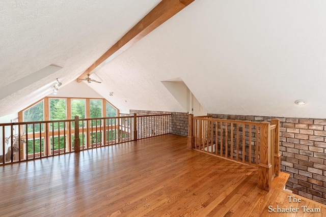 175 Honey Creek Ave NE, Ada, MI 49301 - bonus room with a ceiling fan, wood-type flooring, and a textured ceiling