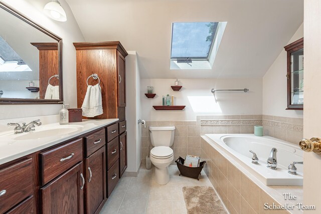 175 Honey Creek Ave NE, Ada, MI 49301 - bathroom with a skylight, a bath, vanity, tile patterned flooring, and vaulted ceiling