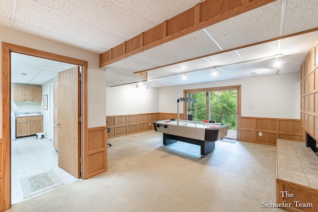 175 Honey Creek Ave NE, Ada, MI 49301 - playroom featuring wainscoting, rail lighting, wooden walls, and light carpet