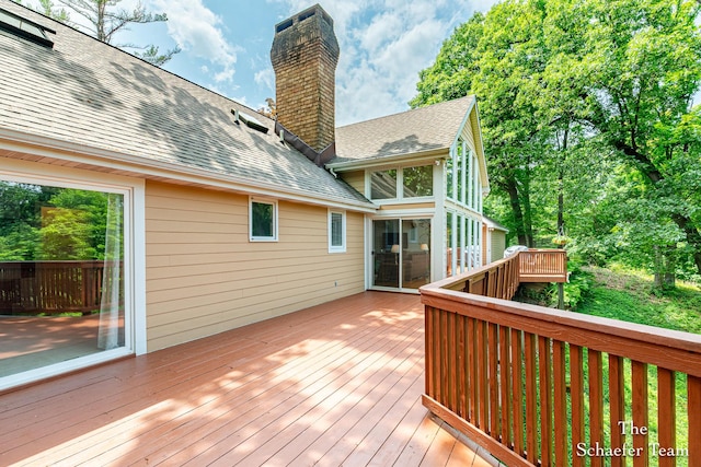 175 Honey Creek Ave NE, Ada, MI 49301 - deck featuring a sunroom