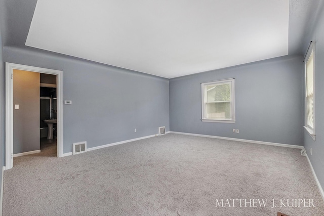 1512 Werner Ave NW, Grand Rapids, MI 49534 - spare room featuring plenty of natural light and carpet floors