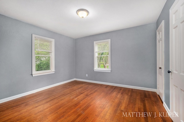 1512 Werner Ave NW, Grand Rapids, MI 49534 - spare room featuring plenty of natural light and hardwood / wood-style floors