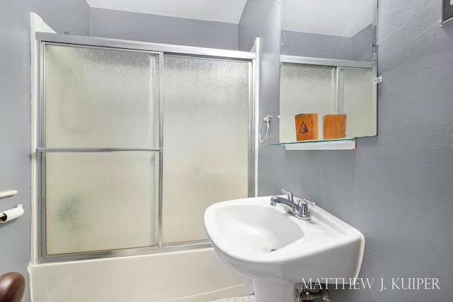 1512 Werner Ave NW, Grand Rapids, MI 49534 - full bathroom with a sink and combined bath / shower with glass door