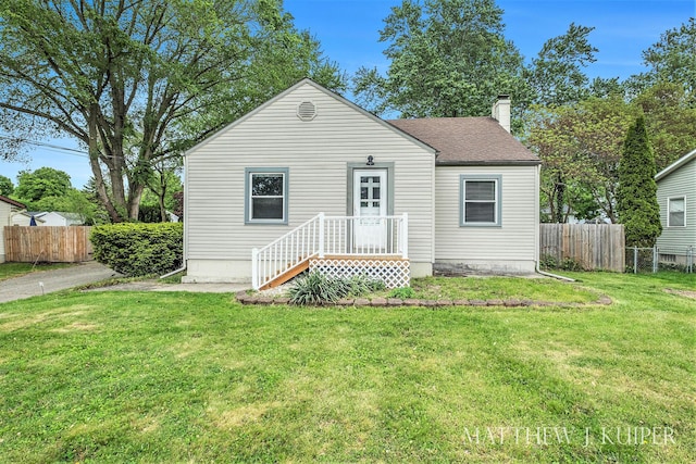 1512 Werner Ave NW, Grand Rapids, MI 49534 - bungalow featuring a chimney and roof with shingles