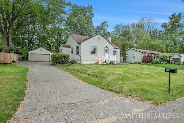 1512 Werner Ave NW, Grand Rapids, MI 49534 - view of front of home with a detached garage, an outdoor structure, and a chimney