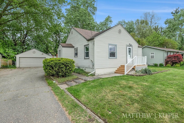 1512 Werner Ave NW, Grand Rapids, MI 49534 - view of front of property with a detached garage, an outdoor structure, a front yard, and a shingled roof
