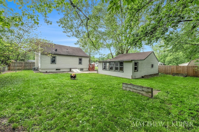 1512 Werner Ave NW, Grand Rapids, MI 49534 - rear view of house with a fenced backyard