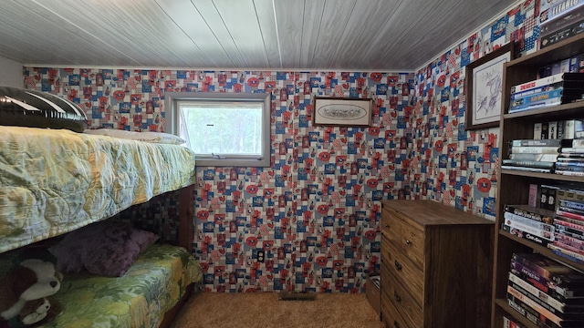 1686 Oak St, Wellston, MI 49689 - carpeted bedroom with wallpapered walls and wooden ceiling