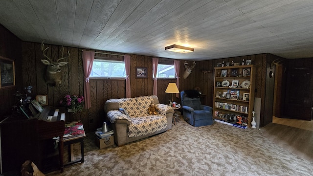 1686 Oak St, Wellston, MI 49689 - living area featuring wood walls and carpet floors