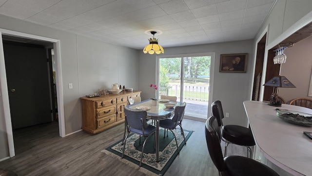 1686 Oak St, Wellston, MI 49689 - dining area with dark wood-style flooring