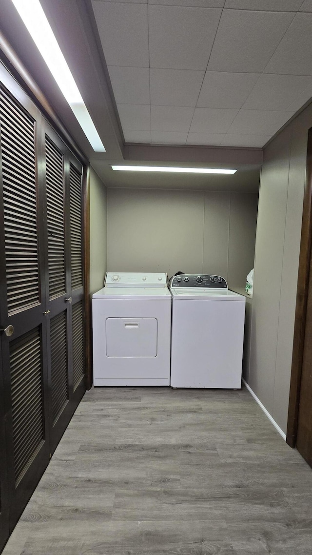 1686 Oak St, Wellston, MI 49689 - laundry room with washer and dryer and light wood-type flooring