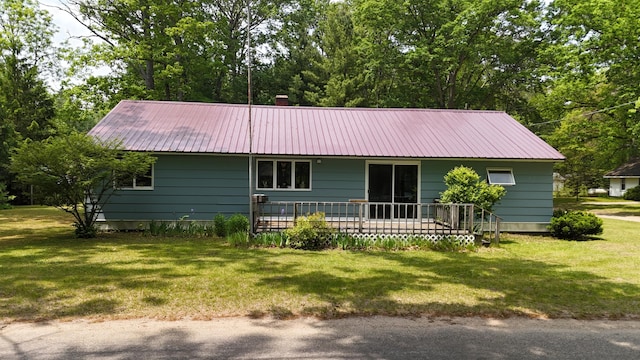 1686 Oak St, Wellston, MI 49689 - ranch-style home with a front lawn and a metal roof