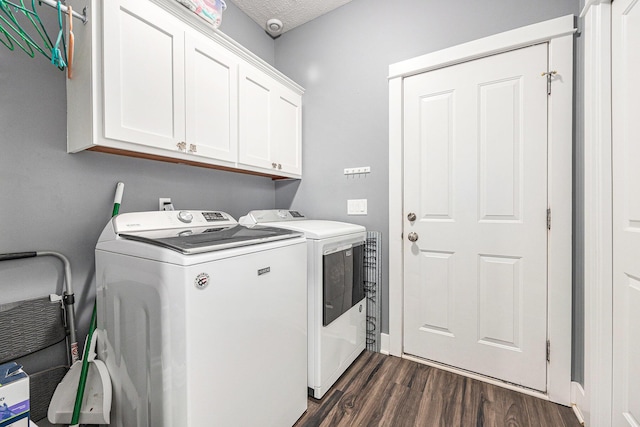7068 Jasper Dr, Hudsonville, MI 49426 - washroom featuring washer and clothes dryer, cabinet space, and dark wood-type flooring