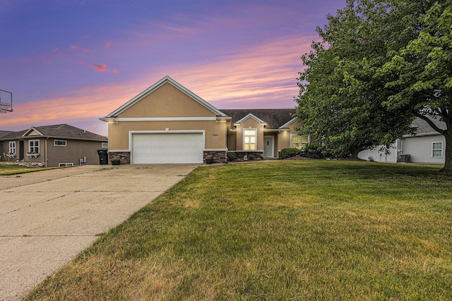 7068 Jasper Dr, Hudsonville, MI 49426 - view of front of house featuring stone siding, stucco siding, driveway, a garage, and a front yard