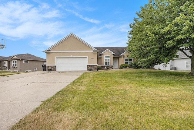 7068 Jasper Dr, Hudsonville, MI 49426 - view of front of house with stucco siding, stone siding, driveway, a garage, and a front yard