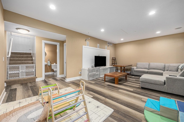 7068 Jasper Dr, Hudsonville, MI 49426 - living area featuring stairway, wood finished floors, and recessed lighting