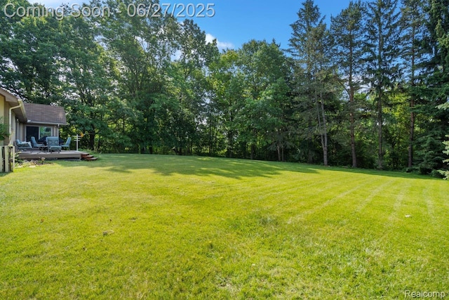 1500 Rustic Ln, Commerce Twp, MI 48390 - view of grassy yard with a wooden deck
