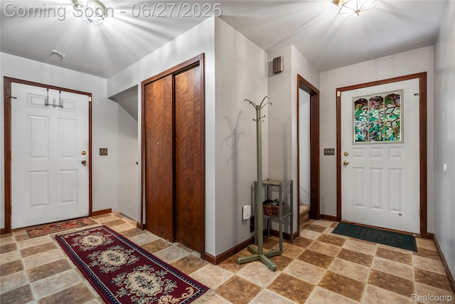 1500 Rustic Ln, Commerce Twp, MI 48390 - entrance foyer with stone tile floors and baseboards