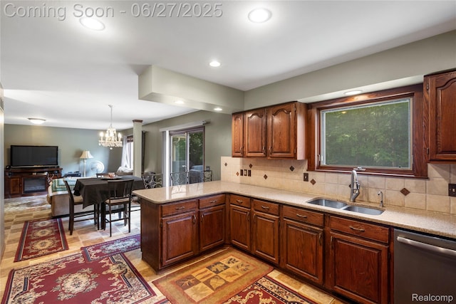 1500 Rustic Ln, Commerce Twp, MI 48390 - kitchen featuring stainless steel dishwasher, light countertops, tasteful backsplash, a chandelier, and recessed lighting