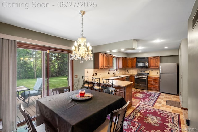 1500 Rustic Ln, Commerce Twp, MI 48390 - dining area with light stone finish floors, a chandelier, and recessed lighting
