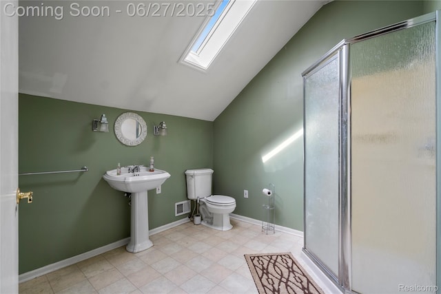 1500 Rustic Ln, Commerce Twp, MI 48390 - bathroom featuring vaulted ceiling, a skylight, a stall shower, and tile patterned floors